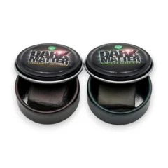 Korda Dark Matter Putty shown in both Weed Green and Gravel Brown tins on a white background.