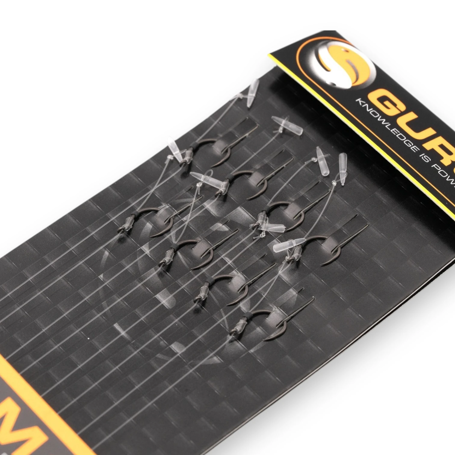 Close-up of Guru QM1 Speed Stop Barbless Rigs 4" hooklengths in original packaging on a white background