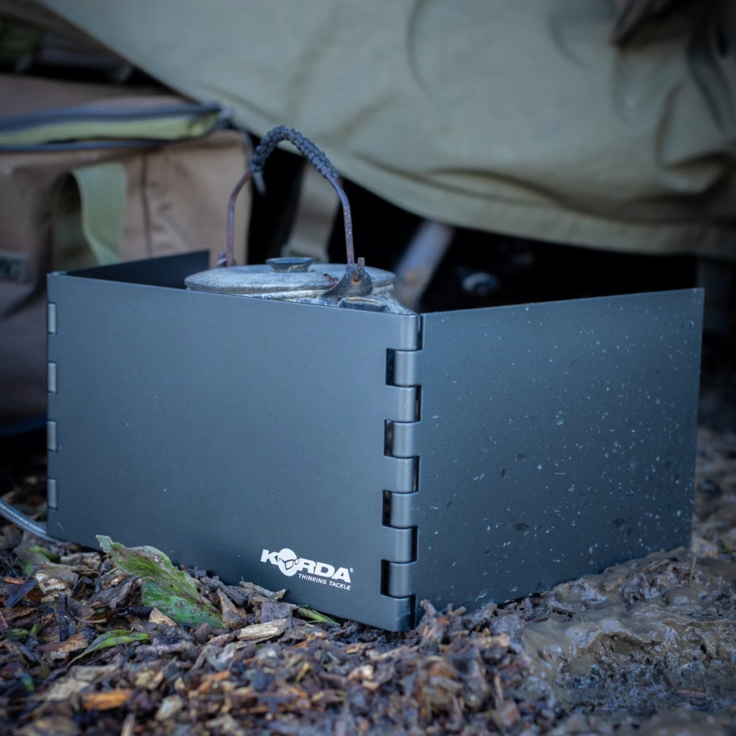 Korda Windshield Large in use around cooking equipment outdoors on the bank
