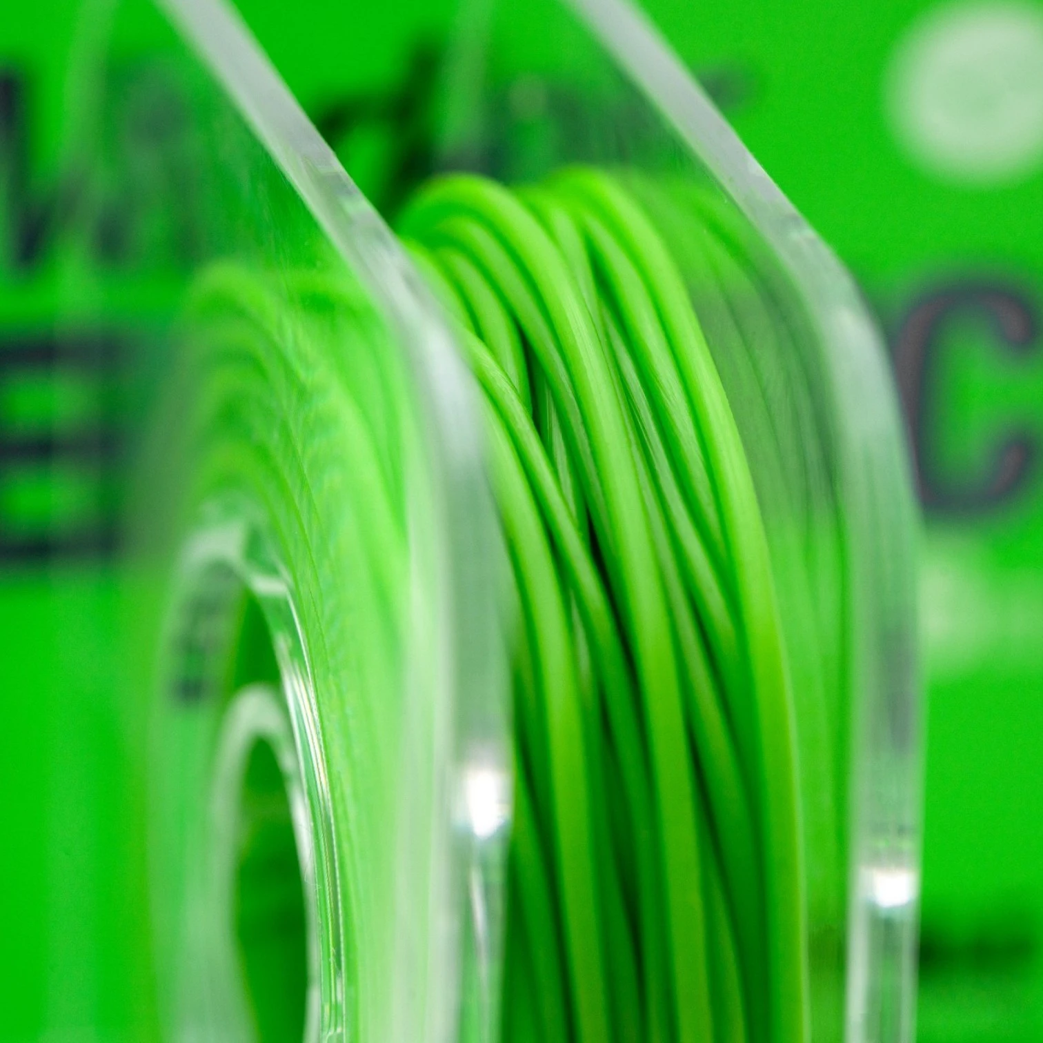Close up of Korda Marker Elastic hi-vis elastic wrapped on spool showing fishing line marking material detail