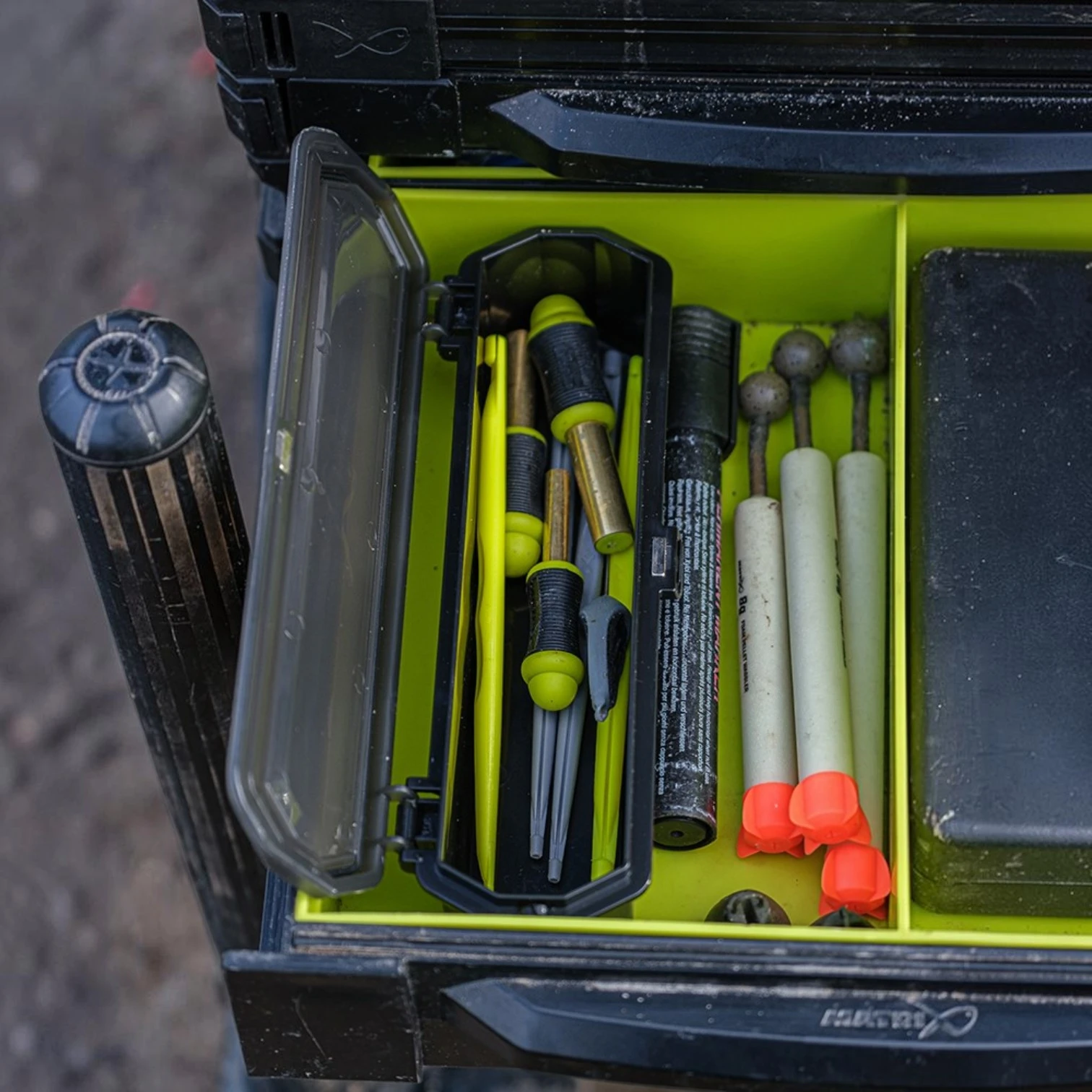 Matrix Slim Accessory Box shown inside seatbox drawer outdoors on fishing bank