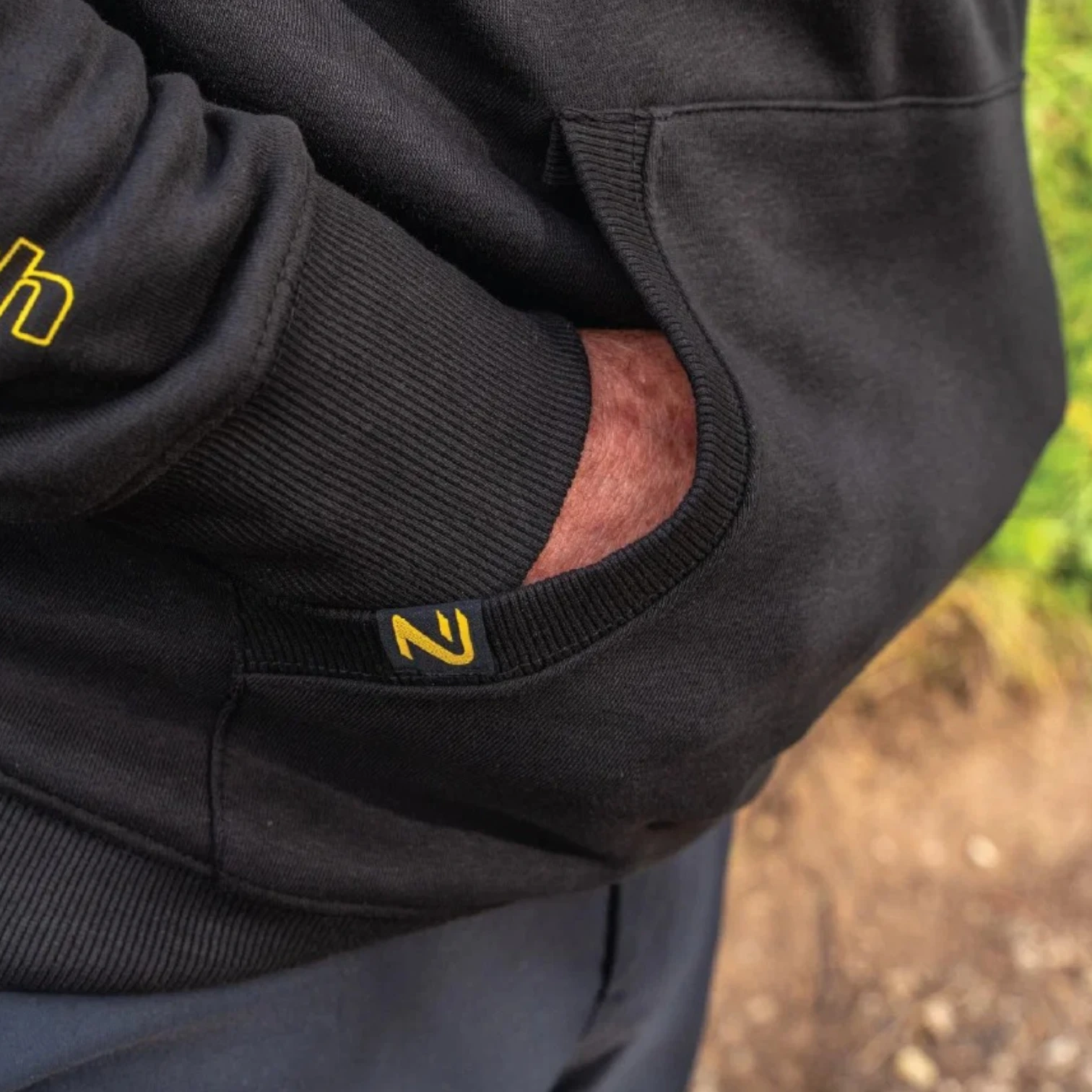 Close up of NuFish Quarter Zip Hoodie front pocket detail and stitching