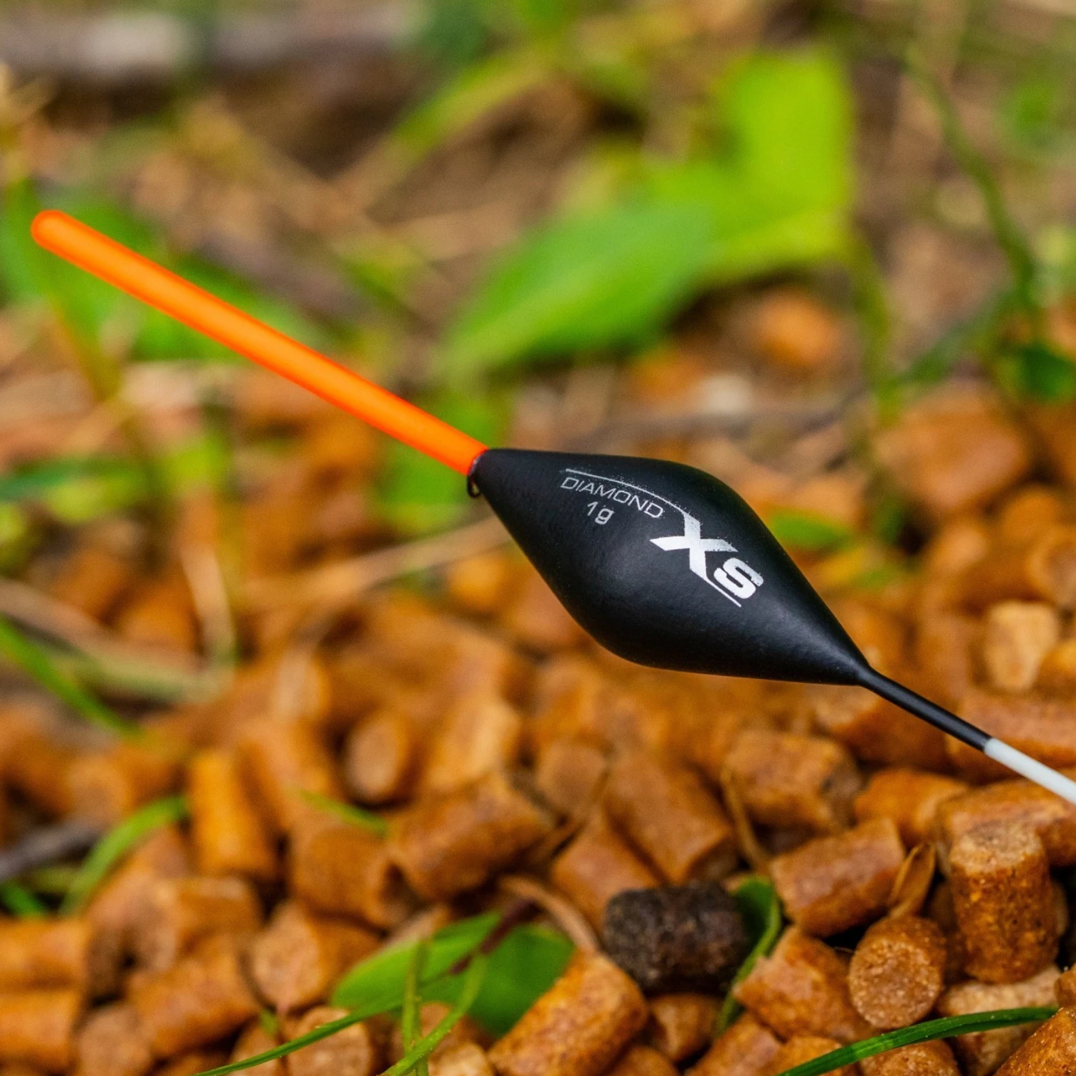 Close-up of the Guru XS Inline Diamond Float highlighting the 2mm hollow bristle, diamond-shaped foam body, and thick fibreglass stem