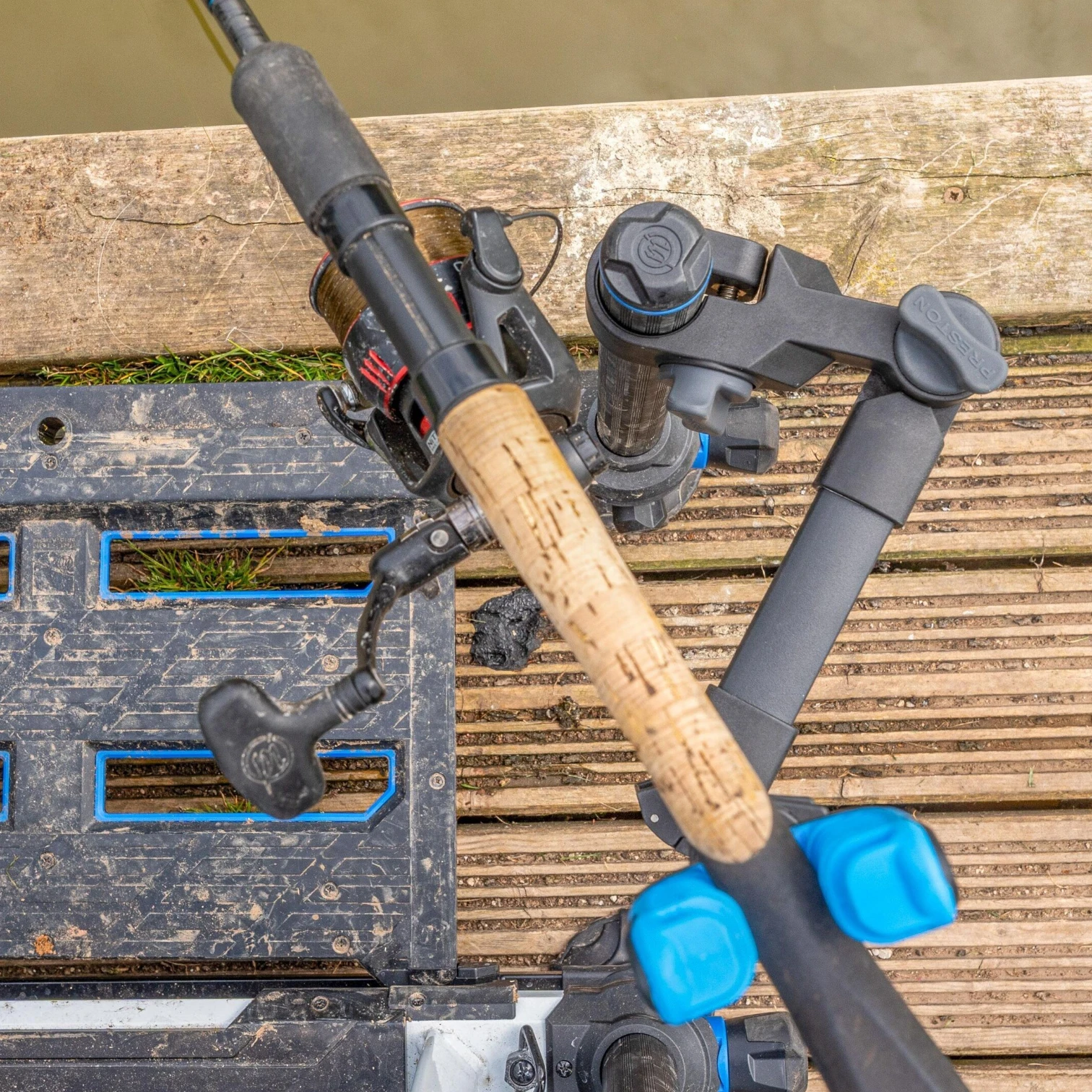 Preston Offbox Rotating Butt Rest Arm shown from above while supporting a fishing rod.